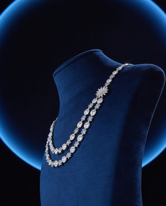 Elegant diamond necklace on a blue mannequin against a dark background