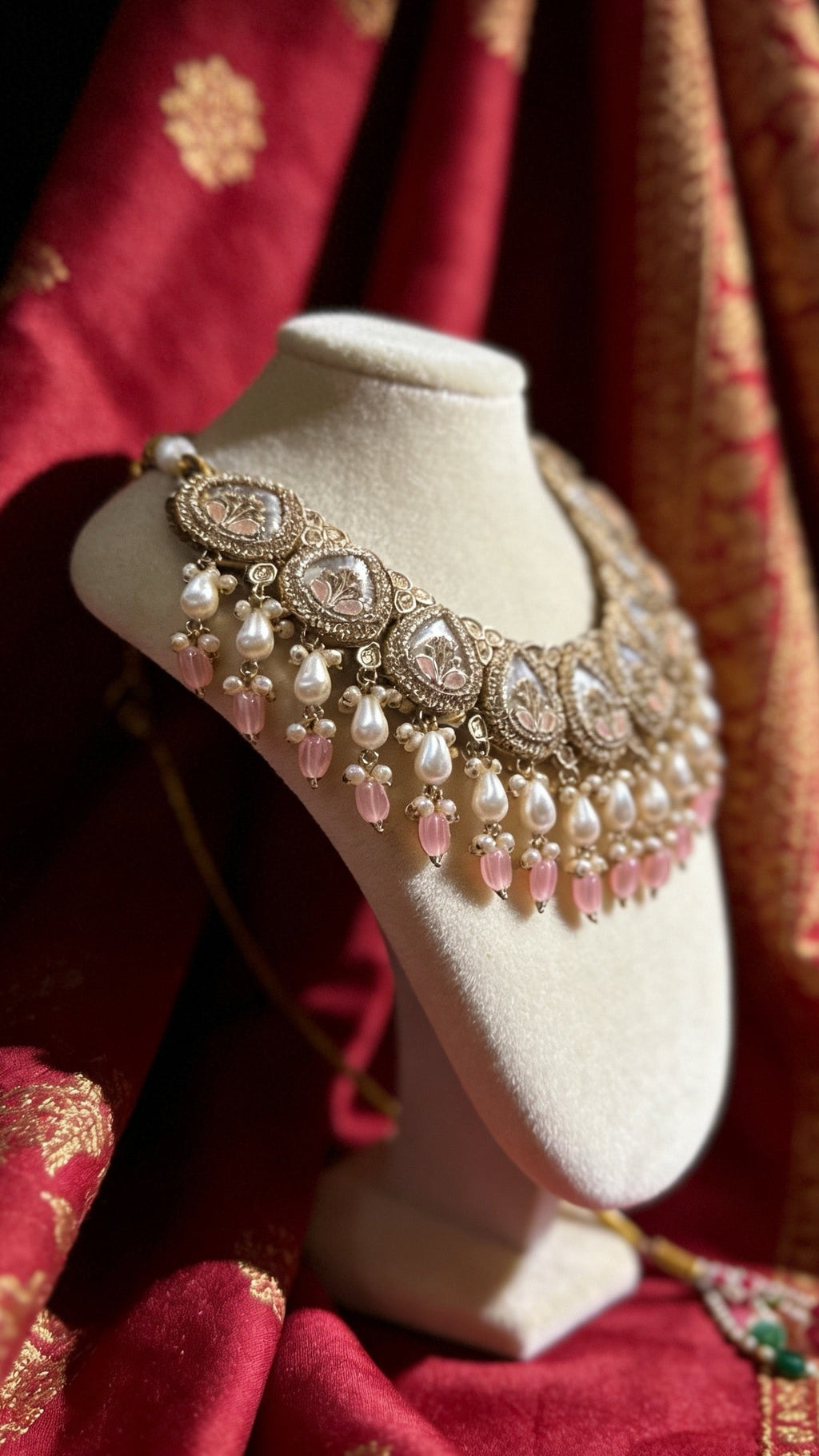 Elegant statement necklace with floral motifs, pearl drops, and blush pink accents. Traditional bridal jewellery perfect for weddings, receptions, and festive occasions.