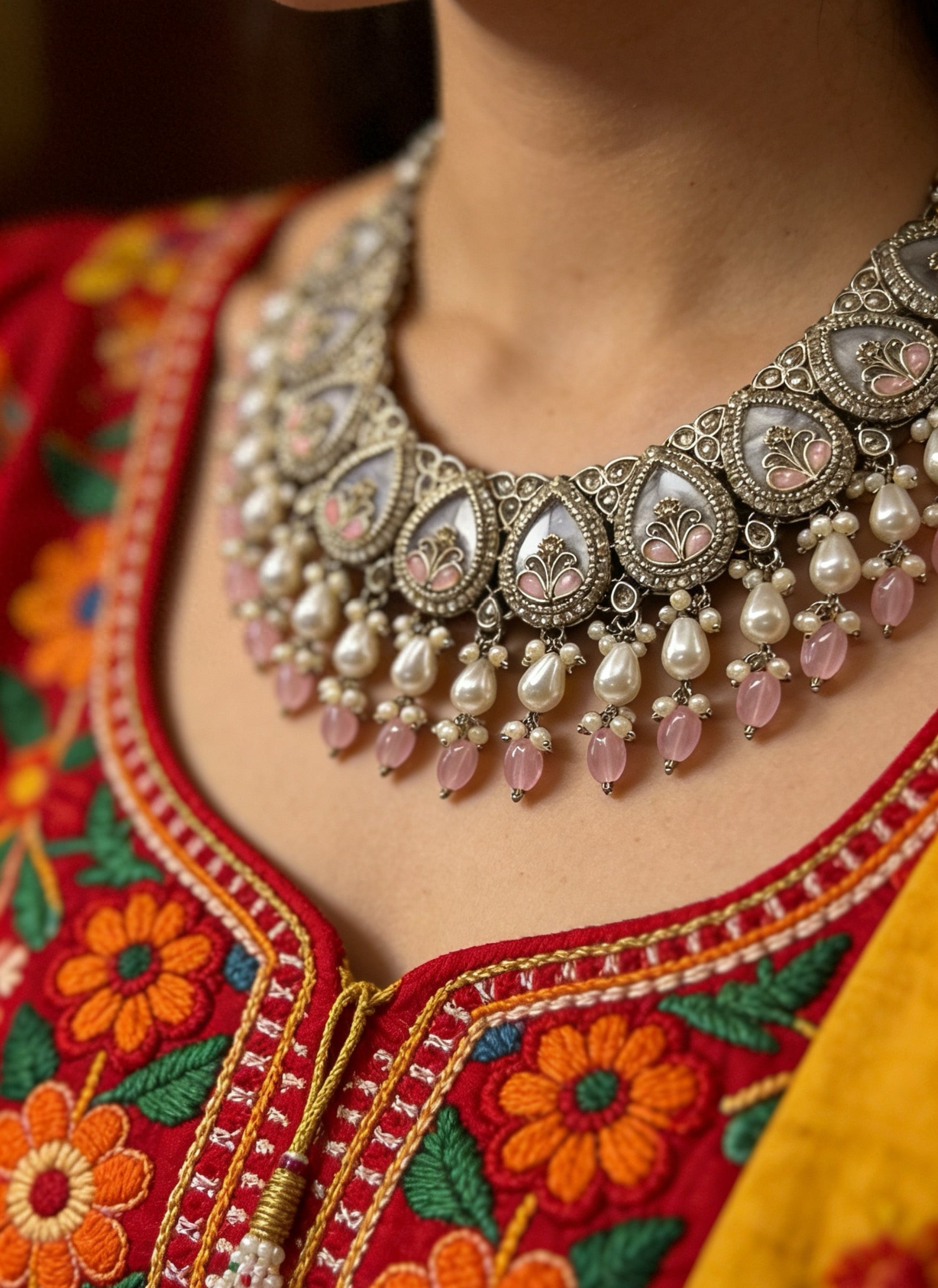 Elegant statement necklace with floral motifs, pearl drops, and blush pink accents. Traditional bridal jewellery perfect for weddings, receptions, and festive occasions.