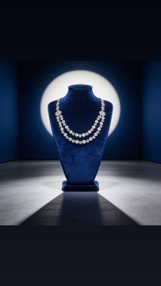 Diamond necklace on a blue velvet mannequin bust against a dark background